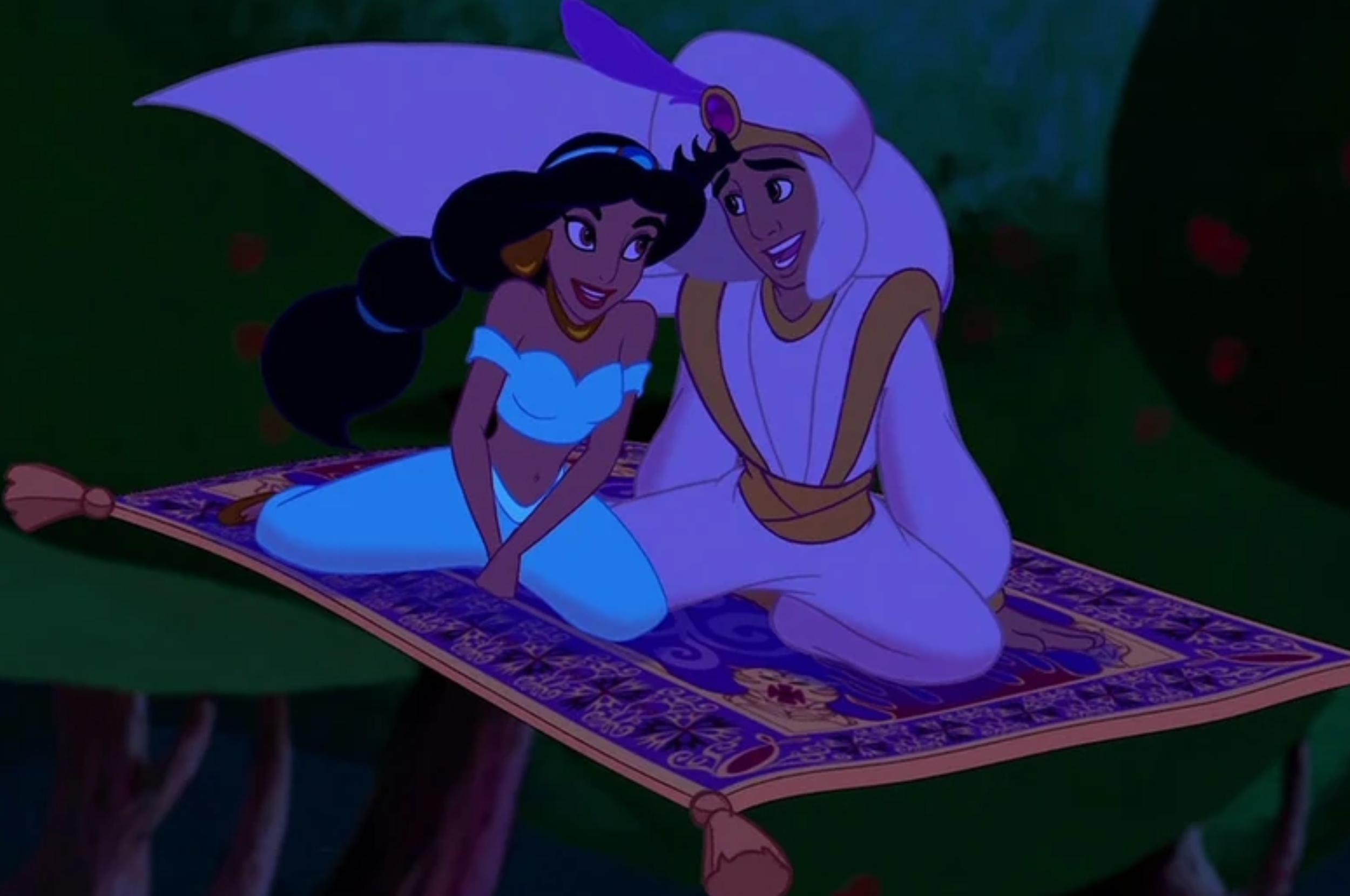 Animated characters Jasmine and Aladdin smile while seated on a flying carpet, suggesting a magical journey