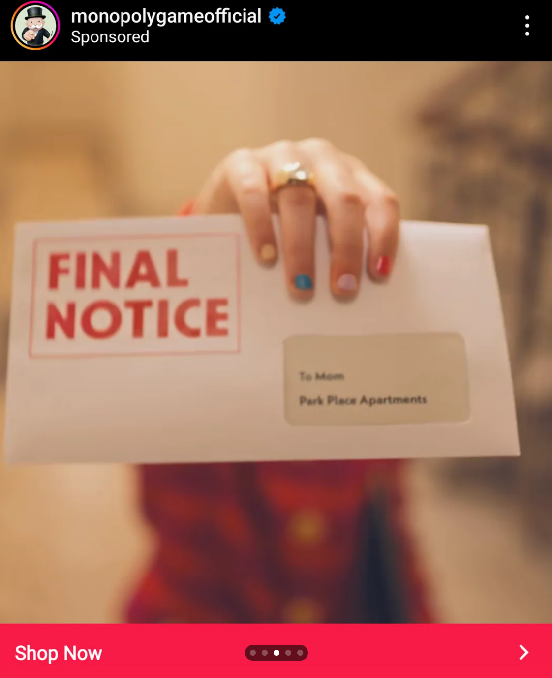 A hand holding an envelope labeled "Final Notice" with colorful painted nails and a ring