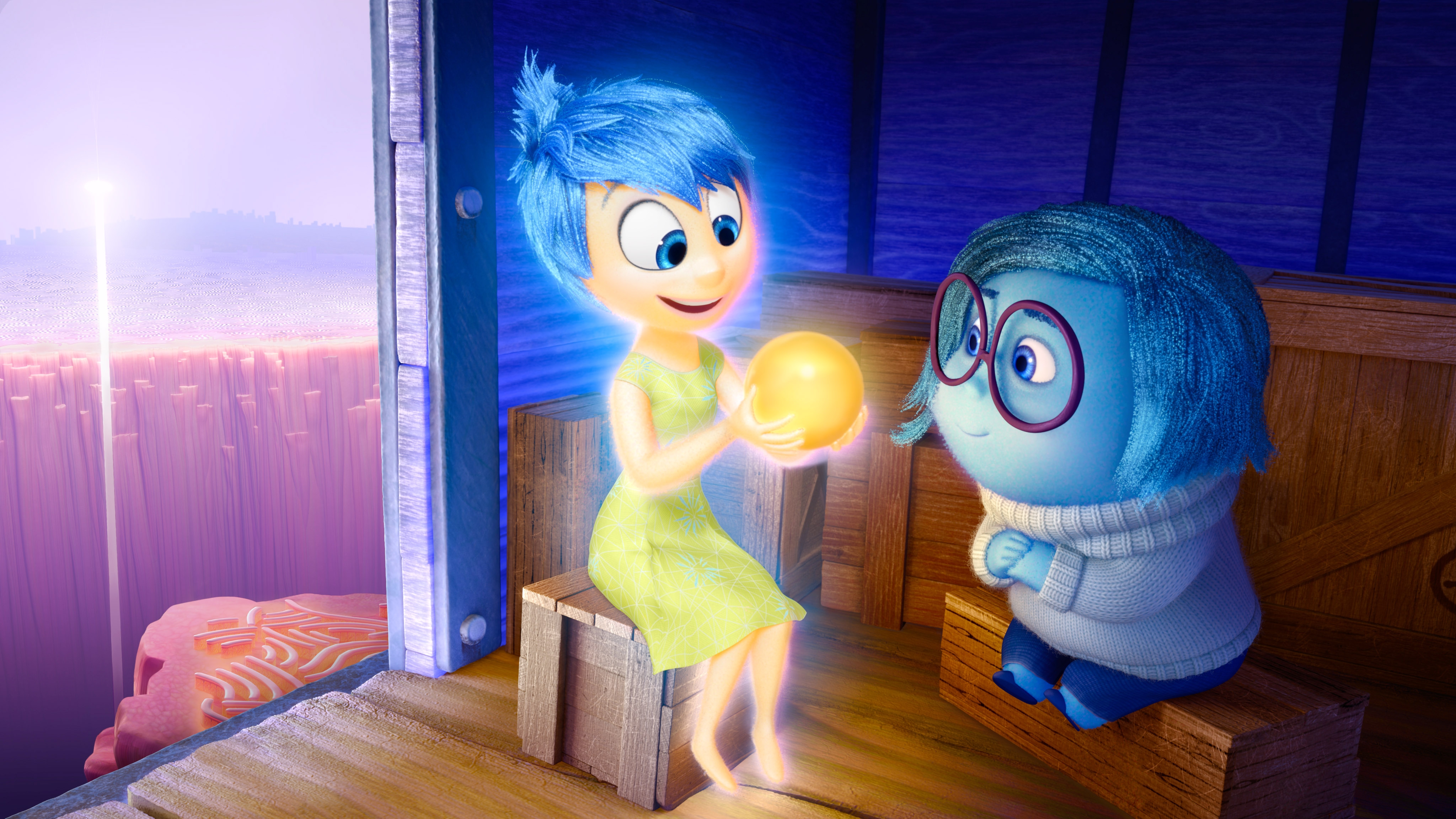 Two animated characters sit together; one holds a glowing orb while the other looks on with interest