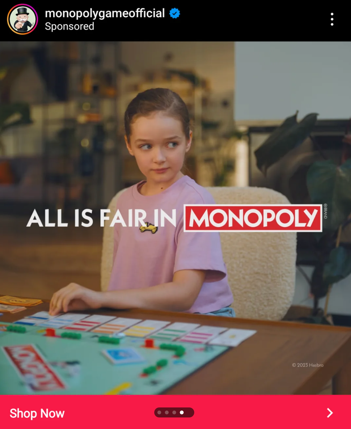 Child playing Monopoly at a table, focused on the game. Text reads: "All is Fair in Monopoly."