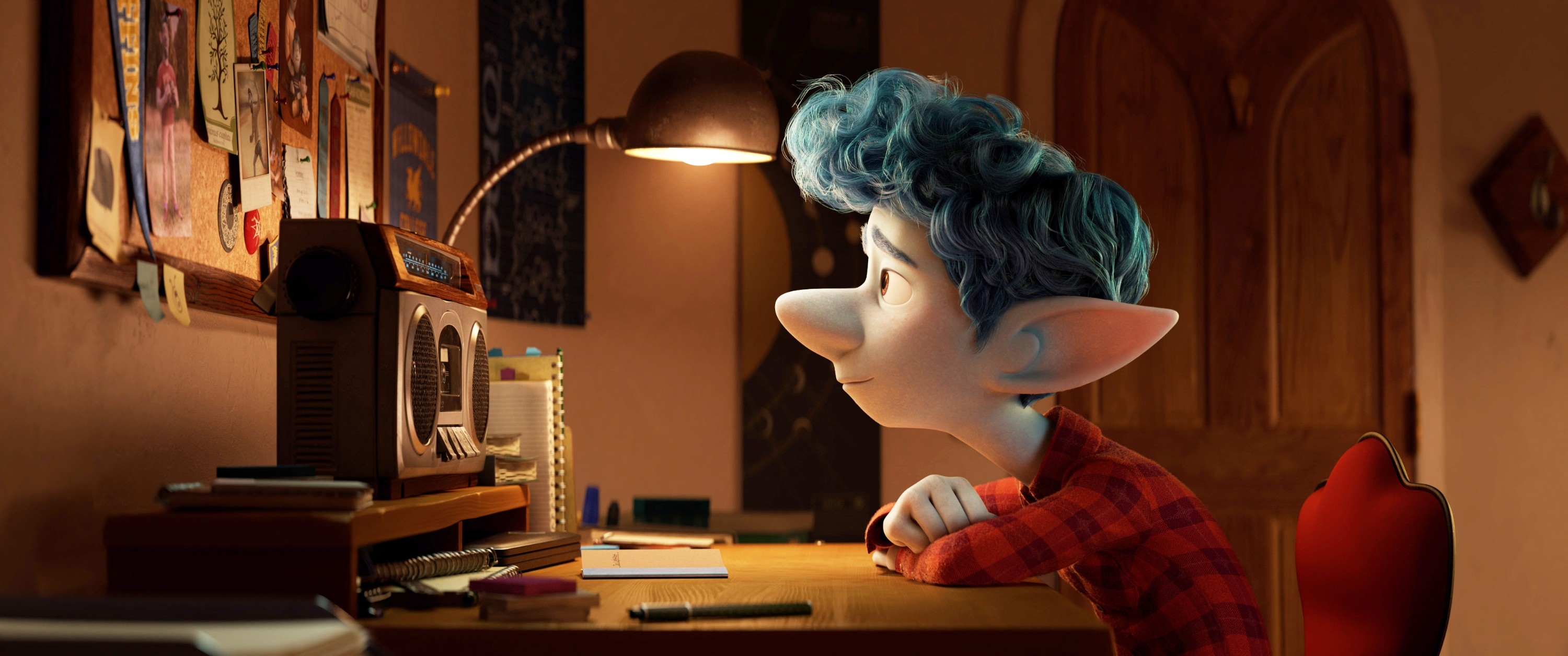 Animated character with blue hair and large ears, wearing a plaid shirt, sits at a desk, gazing at a bulletin board with a radio nearby