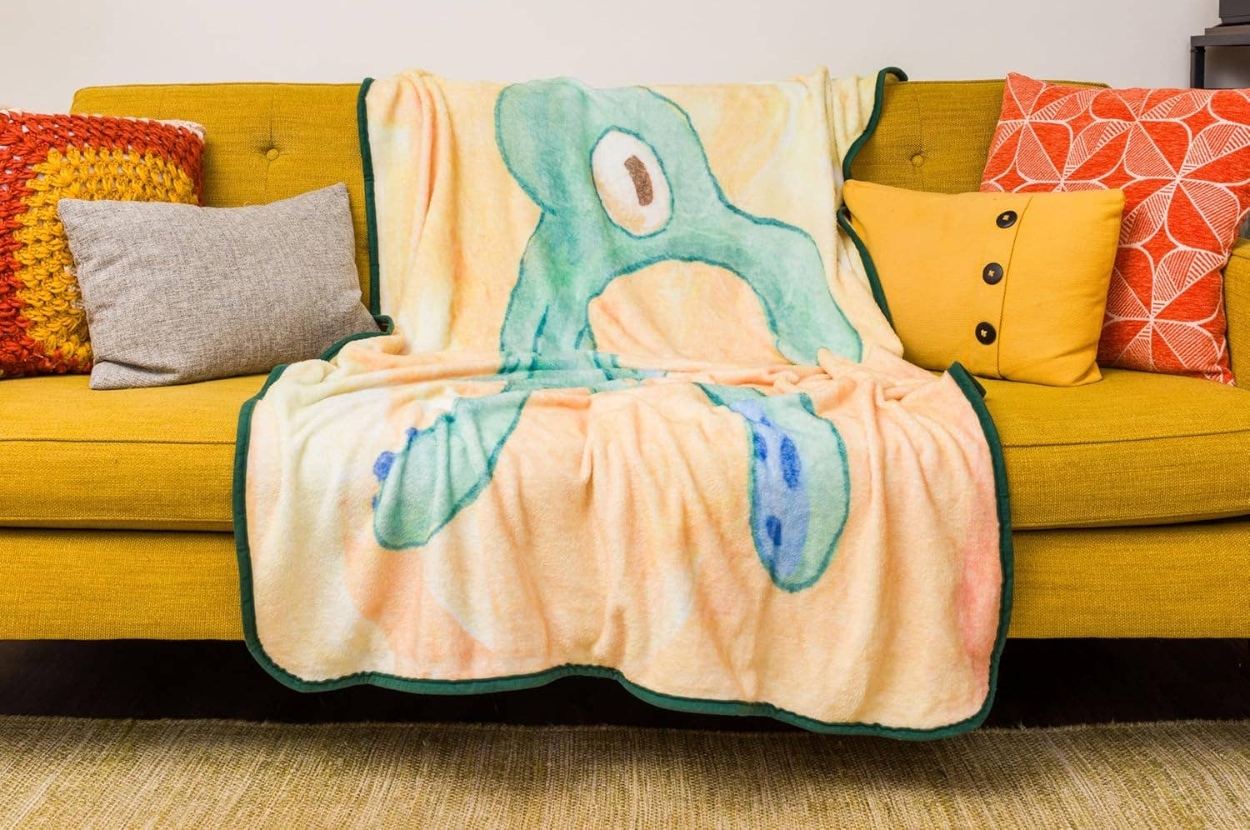 a spongebob themed throw blanket with the "bold and brash" painting on it