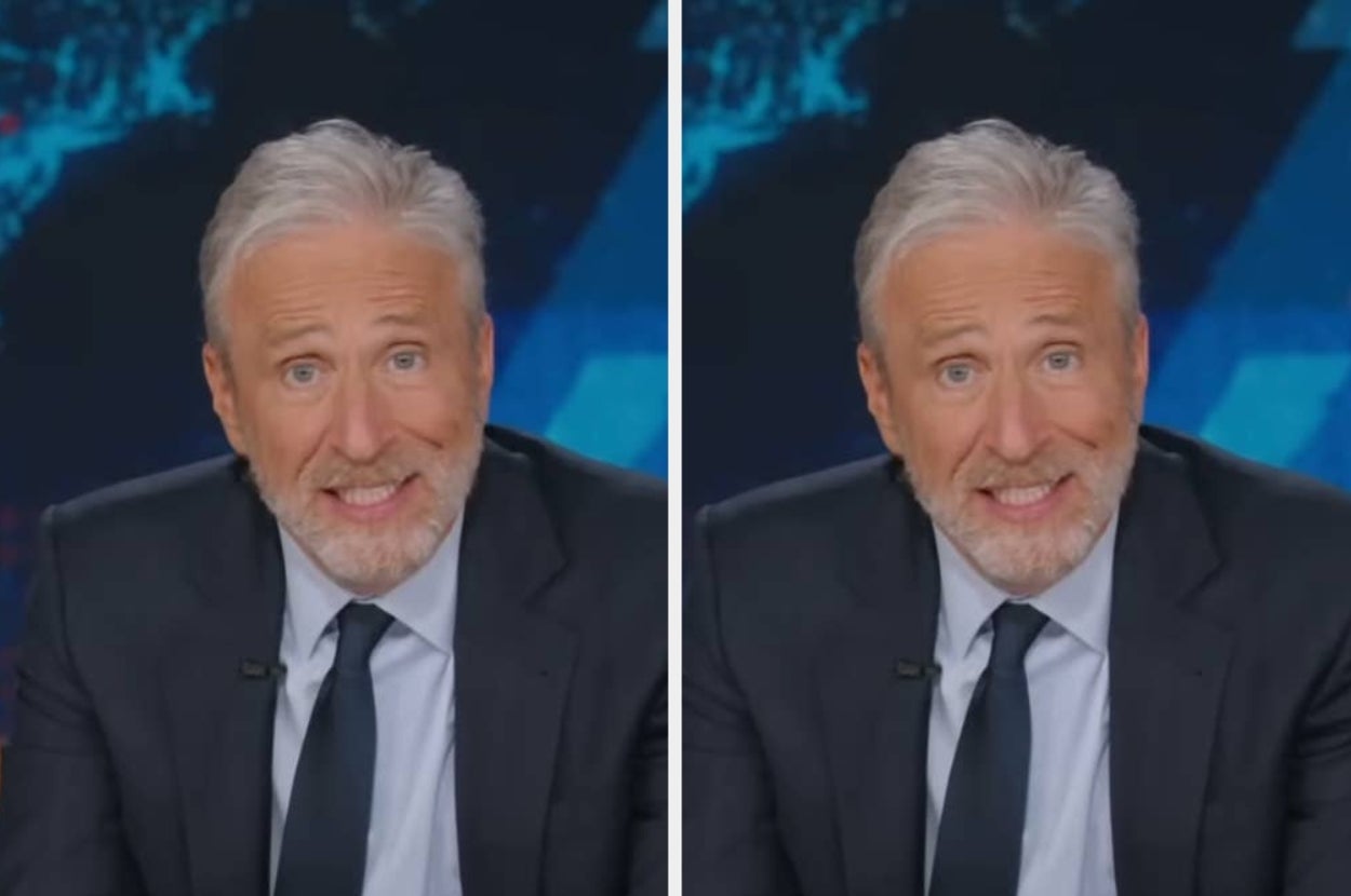 Person with gray hair and beard, wearing a suit and tie, appears on a news set, looking directly at the camera with a neutral expression