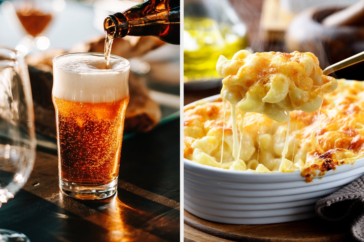 Beer being poured into a glass next to a dish of cheesy mac and cheese, both set on a wooden table