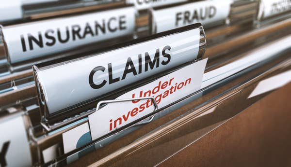 File folders labeled "Insurance," "Claims," and "Fraud" with one marked "Under Investigation" indicating scrutiny of financial matters