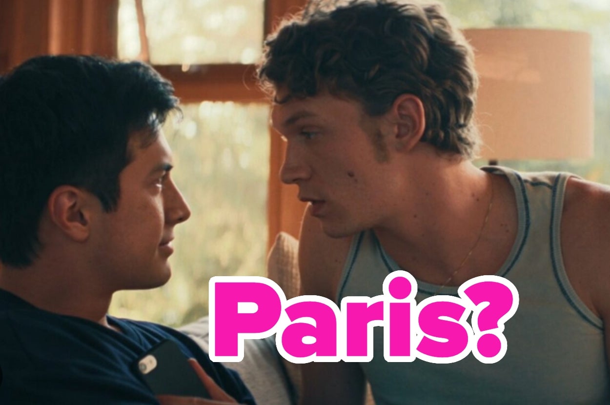 Two people sit together in a close, intimate moment. The text "Paris?" is overlaid on the image