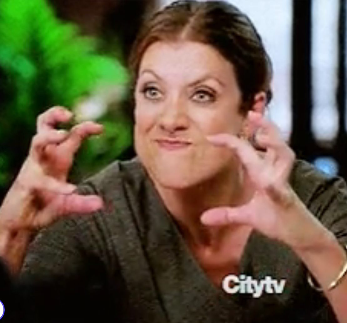 Person with expressive, playful gesture and exaggerated facial expression, hands raised in claw-like pose, indoors, with "Citytv" watermark