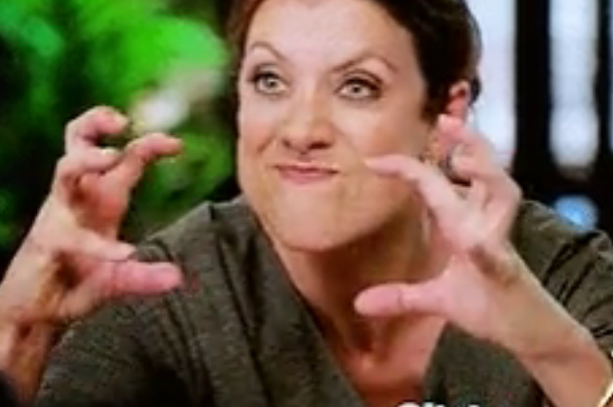 Person with expressive, playful gesture and exaggerated facial expression, hands raised in claw-like pose, indoors, with "Citytv" watermark