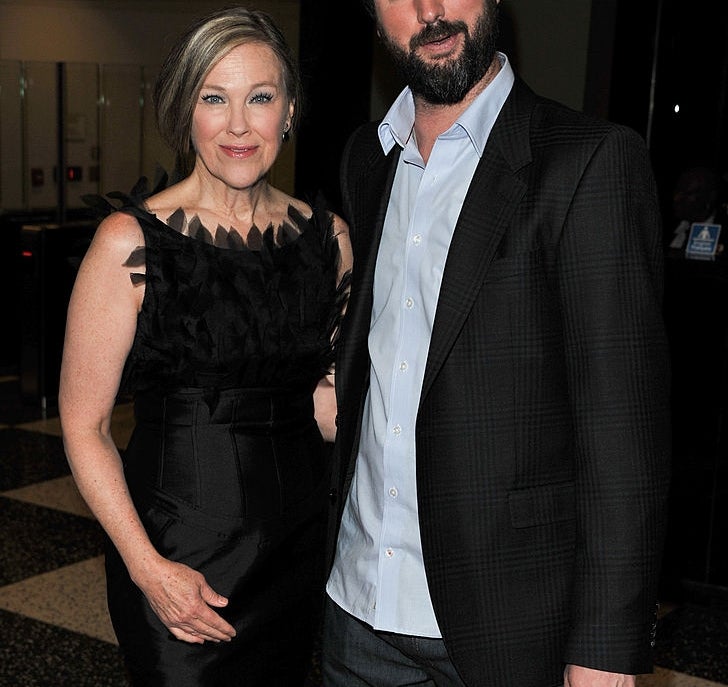 Two radical   airs  connected  a patterned floor. One wears a sleek formal  with textured details; the different   is successful  a suit   with an open-collared shirt