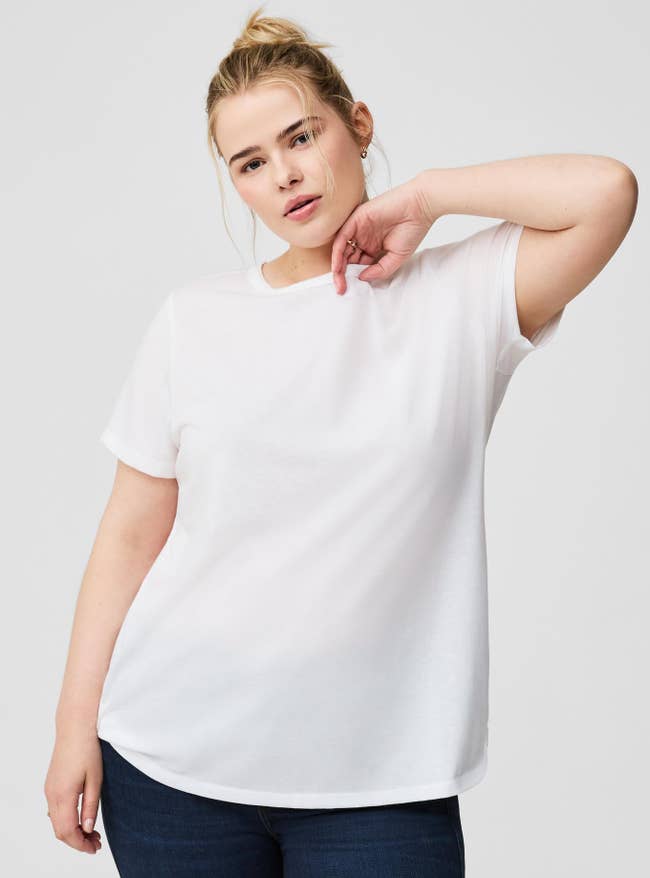 Person poses confidently successful a plain t-shirt and jeans, showcasing casual benignant suitable for mundane wear