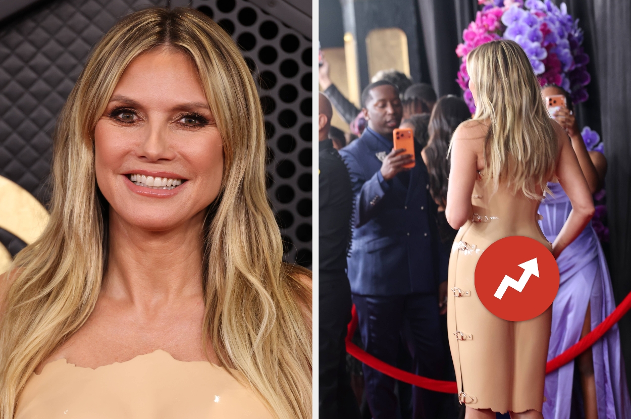 Celebrity in stylish strapless dress on red carpet, with people taking photos in the background