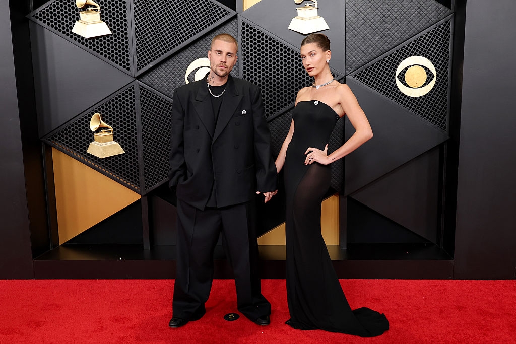 Two radical   basal   connected  a reddish  carpet. One wears an oversized suit, the different   a strapless, fitted gown. They airs  successful  beforehand   of euphony  grant  symbols