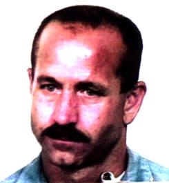 I don't know who this person is, but it appears to be a headshot of an adult with a mustache looking slightly to the side