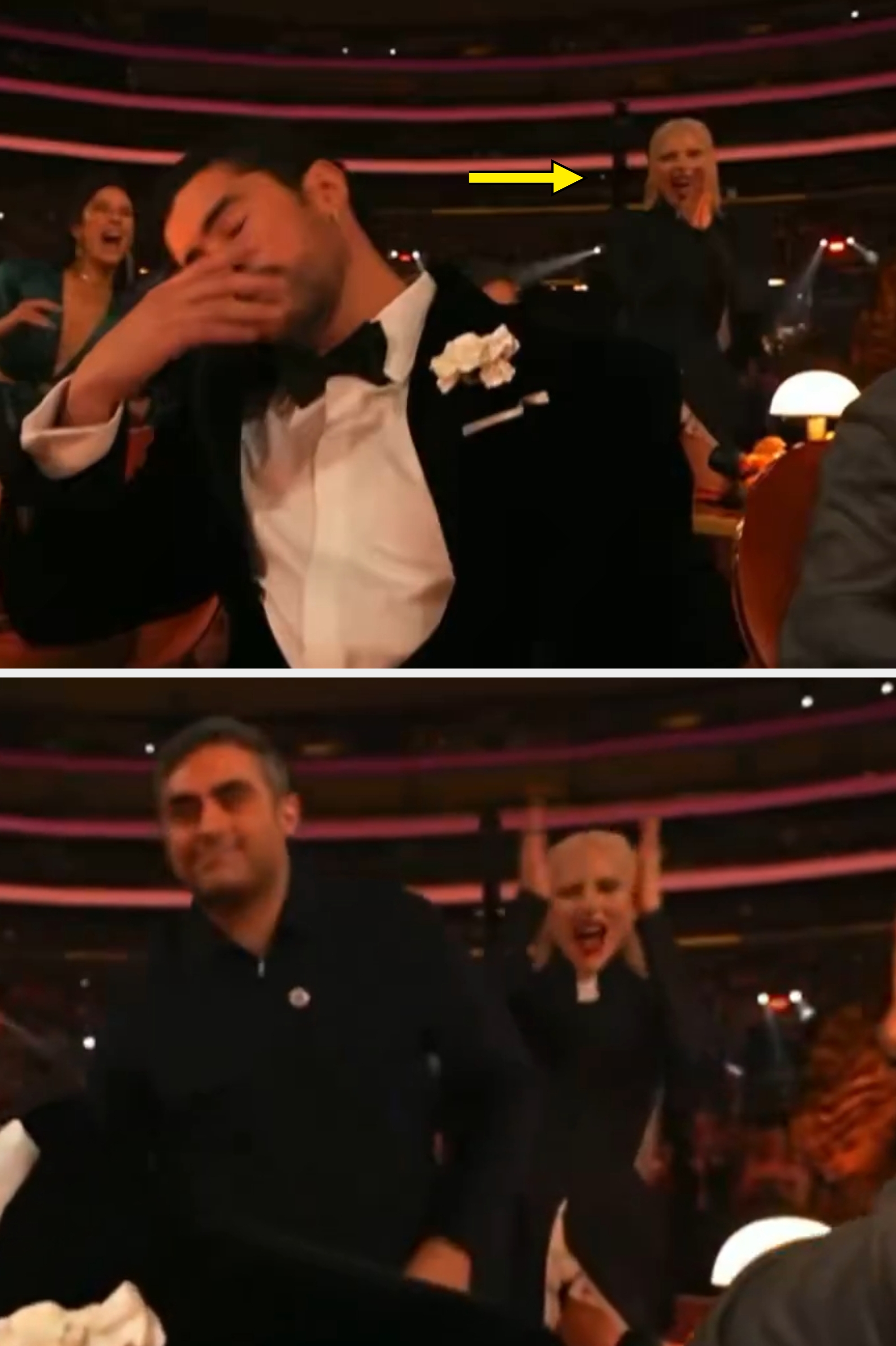 A antheral   successful  a tuxedo with a floral boutonnière sits astatine  a table, appearing emotional, arsenic  the assemblage  astir   him cheers successful  a ceremonial  lawsuit   setting