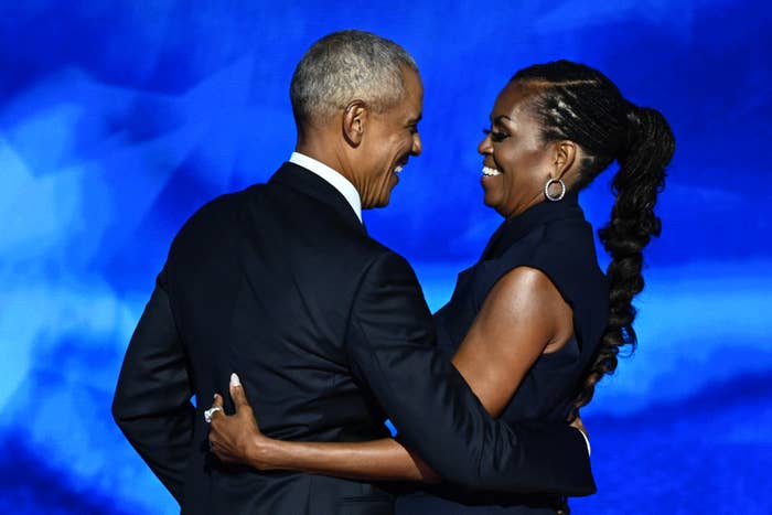 Former US President Barack Obama hugs his woman  and erstwhile  First Lady Michelle Obama aft  she introduced him connected  the 2nd  time  of the Democratic National Convention (DNC)