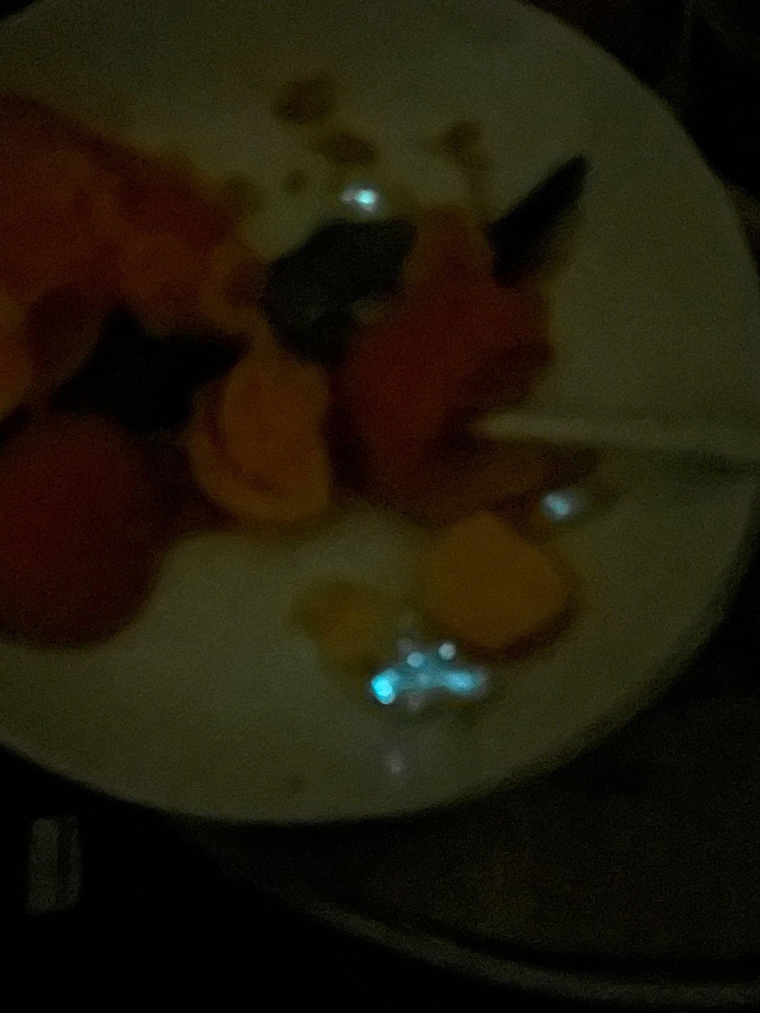 Dimly lit sheet  with assorted nutrient  items, including what appears to beryllium  a spoon. Difficult to separate  nonstop   contents