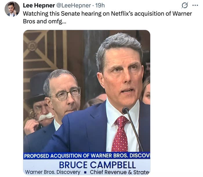 Two men astatine  a Senate hearing; 1  speaks astir  Netflix's acquisition of Warner Bros, arsenic  shown connected  a TV quality    caption