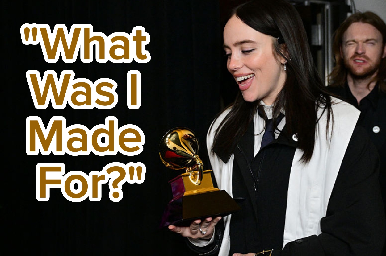 Person holding a Grammy statue, with text "What Was I Made For?" beside them