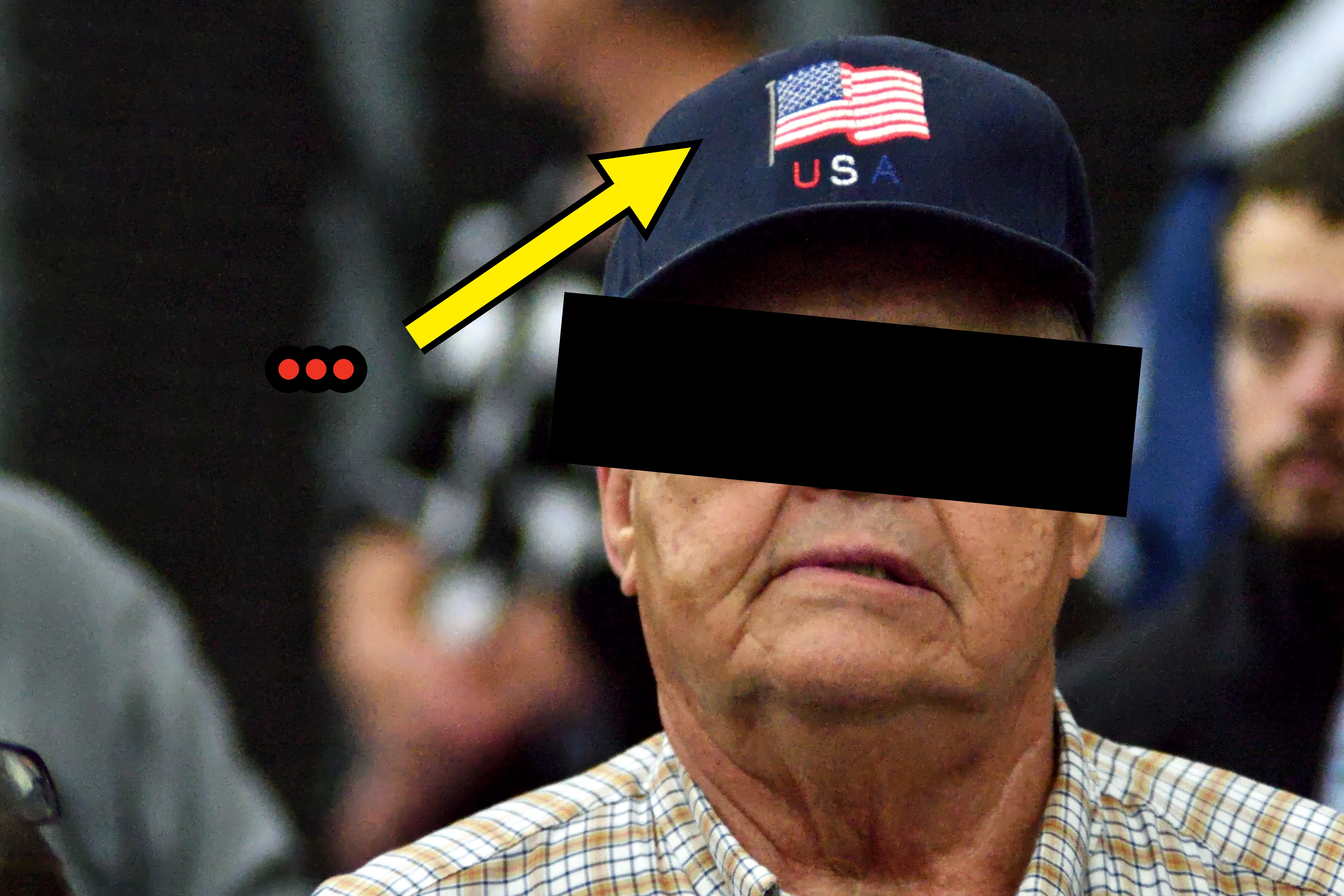 Man wearing glasses and a USA cap, lasting  successful  a crowd