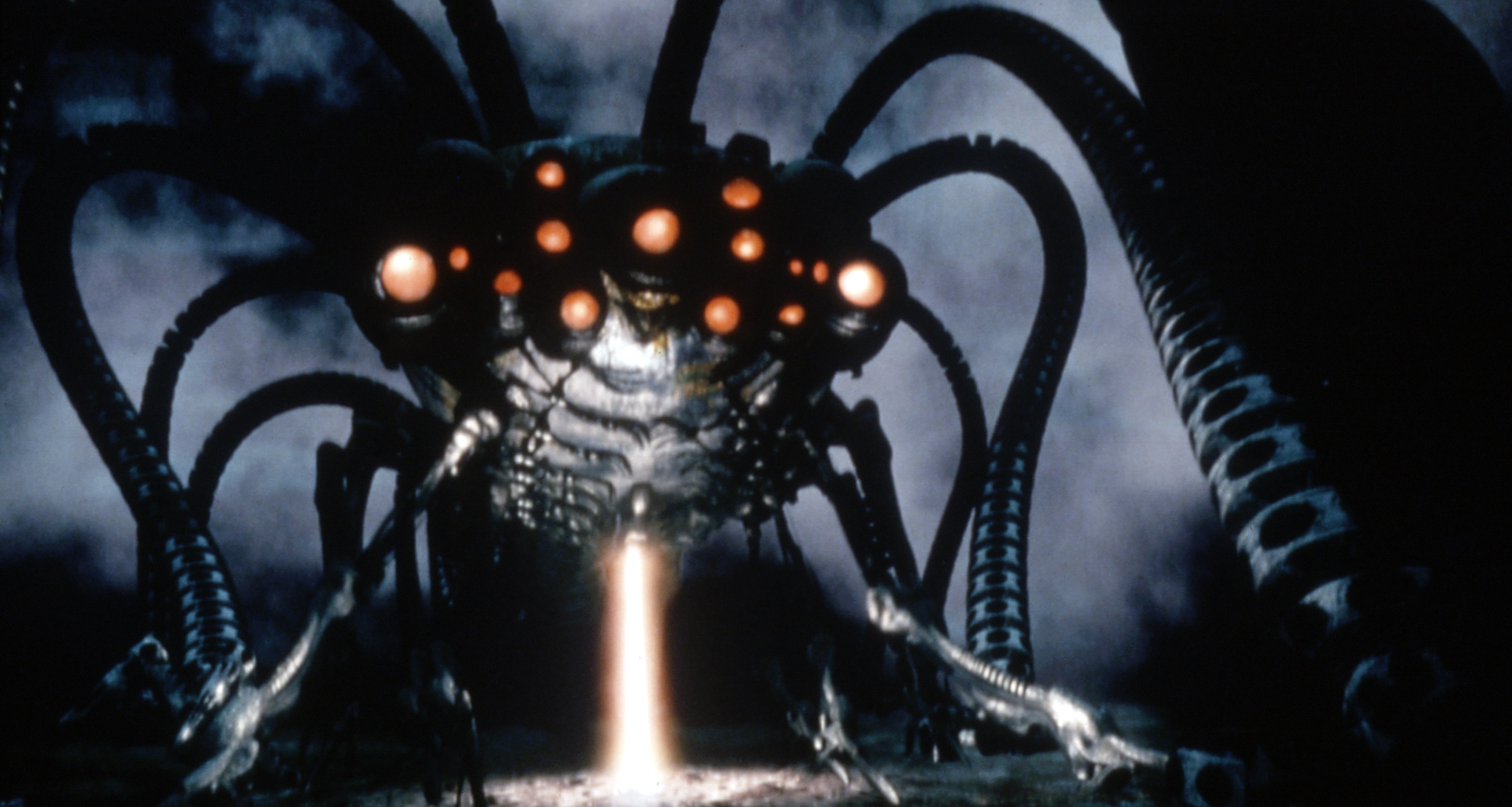 Mechanical creature with multiple tentacle-like appendages and glowing eyes, extending a beam of light from its center in a dark, misty setting