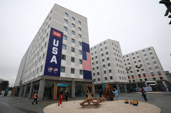 Exterior presumption    of Team USA's Olympic Village accommodations, featuring a ample  USA banner and the American flag