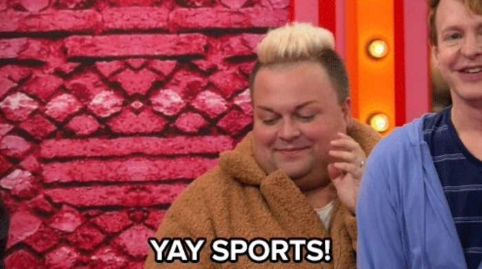 Person wearing a fluffy jacket humorously cheers with the text "YAY SPORTS!" in front of a patterned backdrop