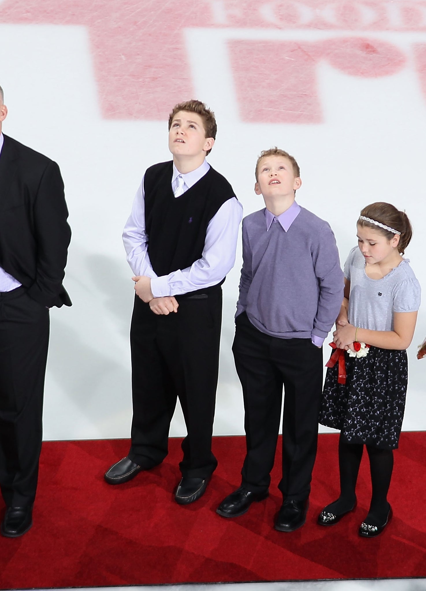 Keith and his sons erstwhile   they were children, lasting  connected  a reddish  carpet connected  the crystal  during a ceremony