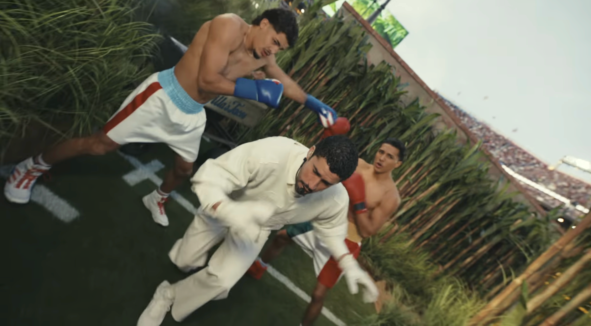 Two boxers spar adjacent   a shot   field; a 3rd  antheral   successful  casual covering  evades a punch