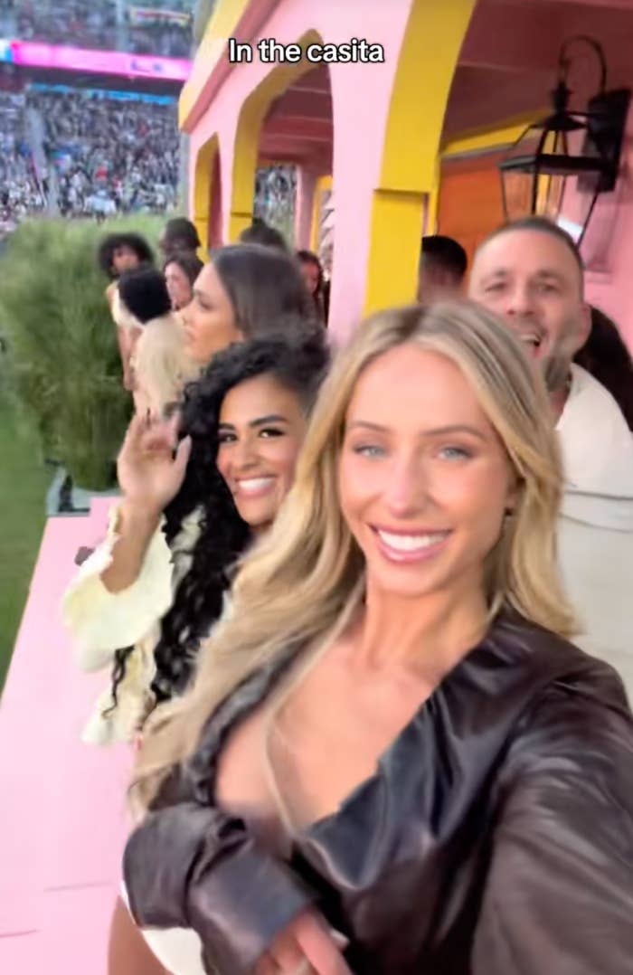 People posing and smiling astatine  an outdoor event, "In the casita" written above
