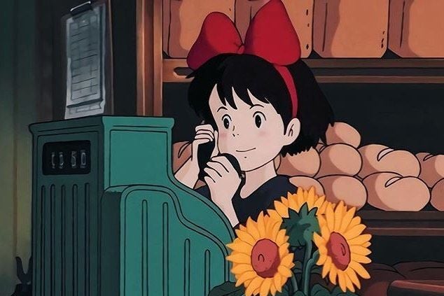 Kiki on the phone in "Kiki's Delivery Service" in a bakery