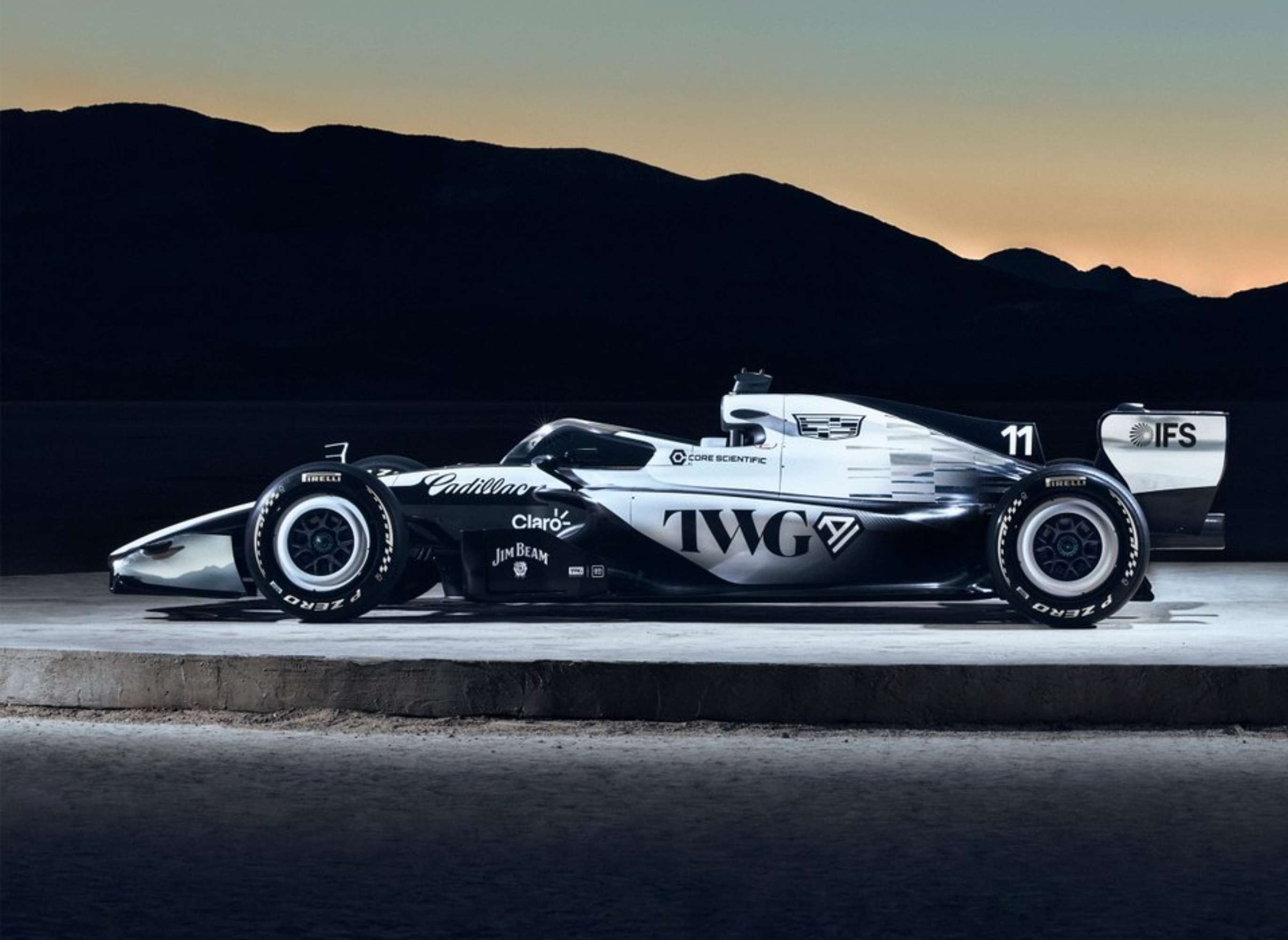 Race car displayed on a track at sunset, sleek aerodynamic design, with visible sponsor logos and number 11 on the side