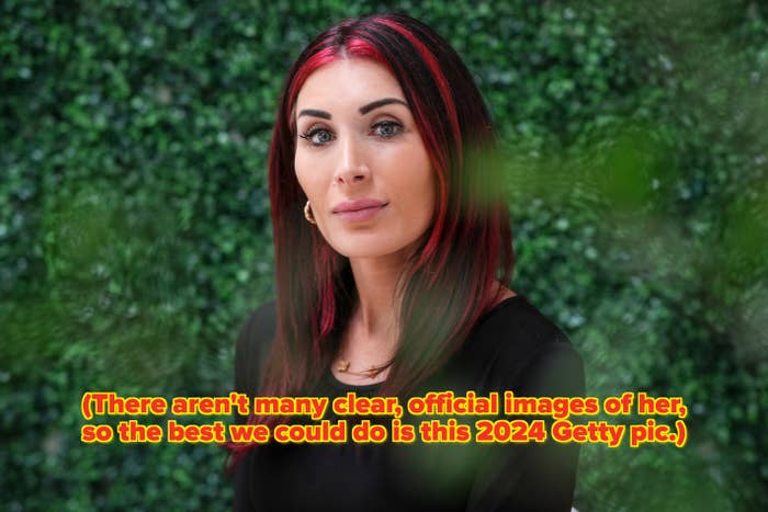 Person with agelong  hairsbreadth  and hoop earrings, wearing a achromatic  top, sits successful  beforehand   of leafy greenish  background