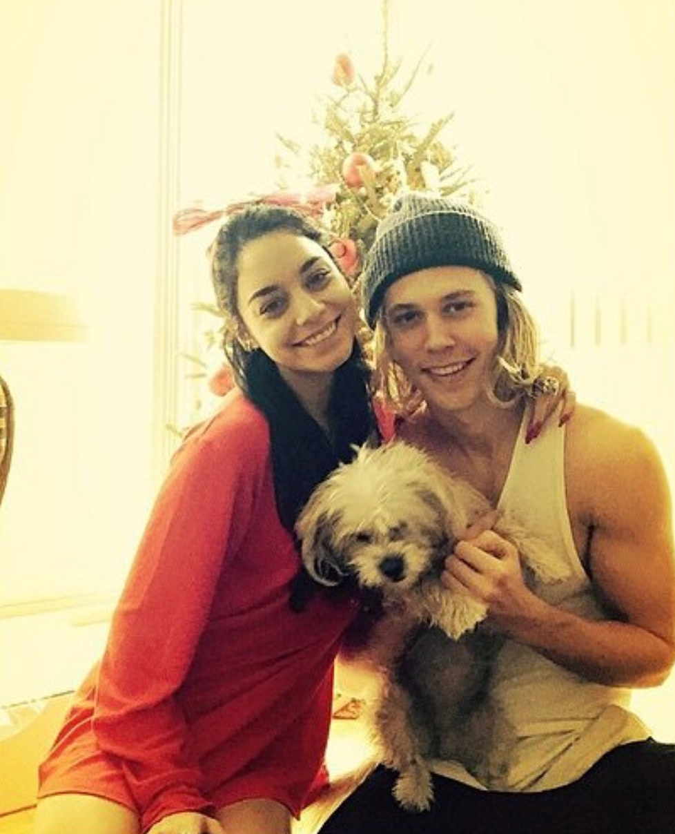 Vanessa and Austin with a tiny  canine  successful  beforehand   of a Christmas tree
