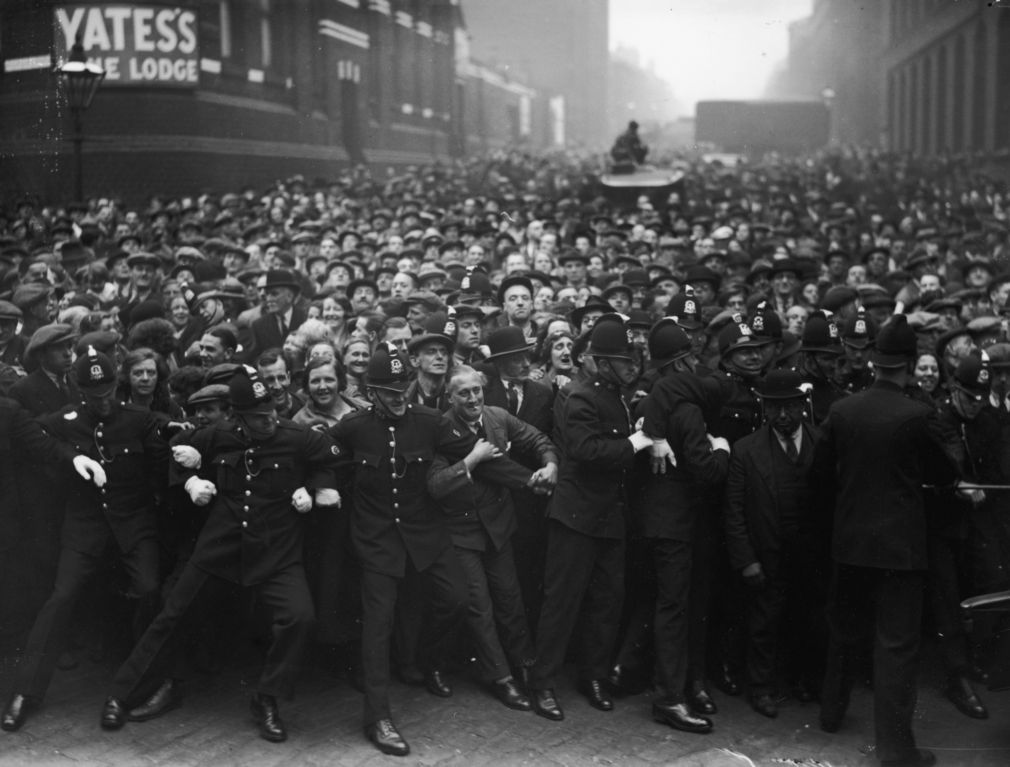 Historic photograph  of constabulary  forming a obstruction  against a ample  assemblage  of radical   extracurricular  a venue
