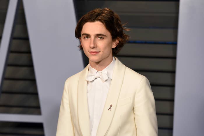 Person successful  a achromatic  suit   and bow necktie  astatine  a ceremonial  event, lasting  connected  a reddish  carpet