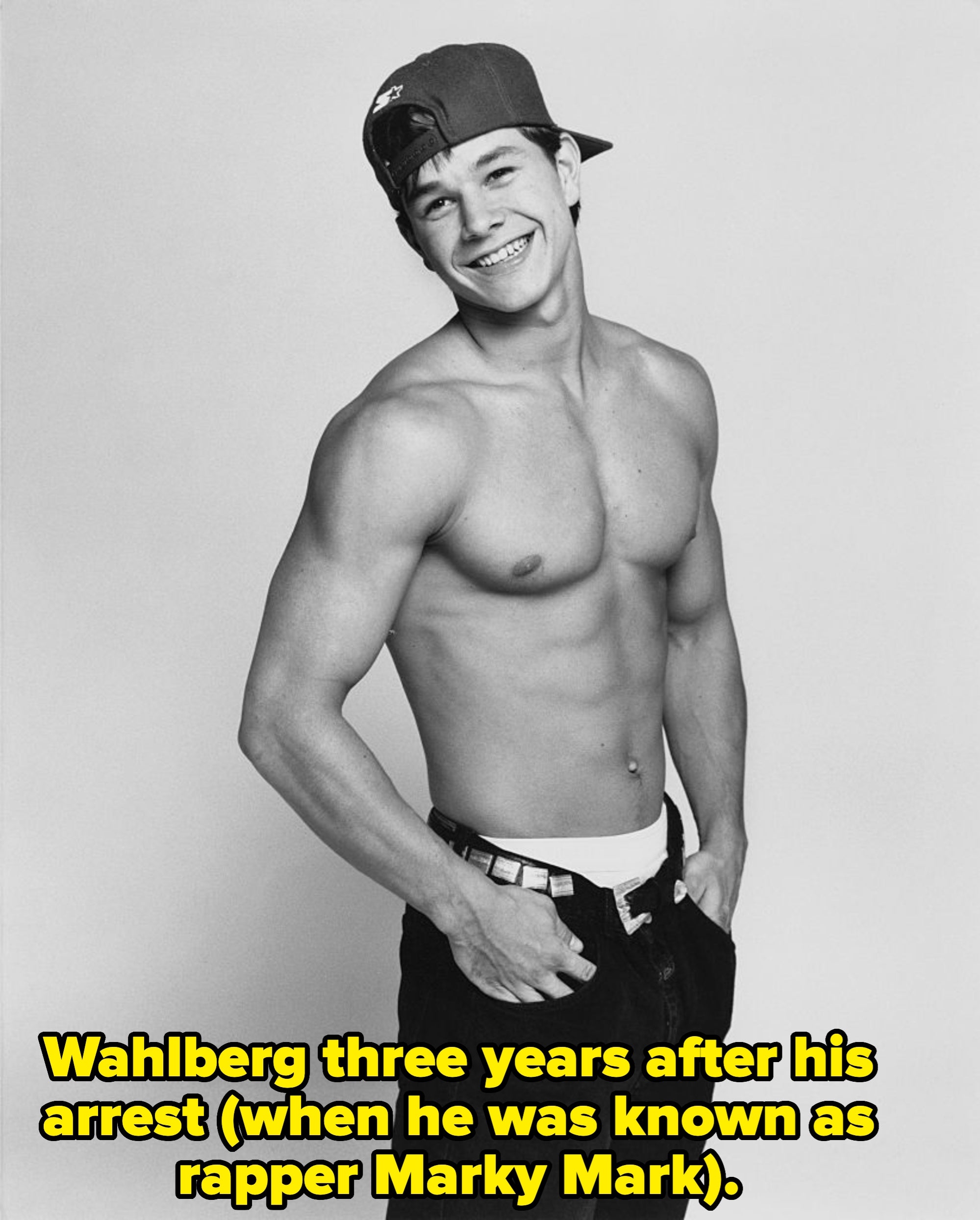 Person smiling, wearing a backwards cap, jeans, and nary  shirt, with hands successful  pockets. Casual and assured  pose