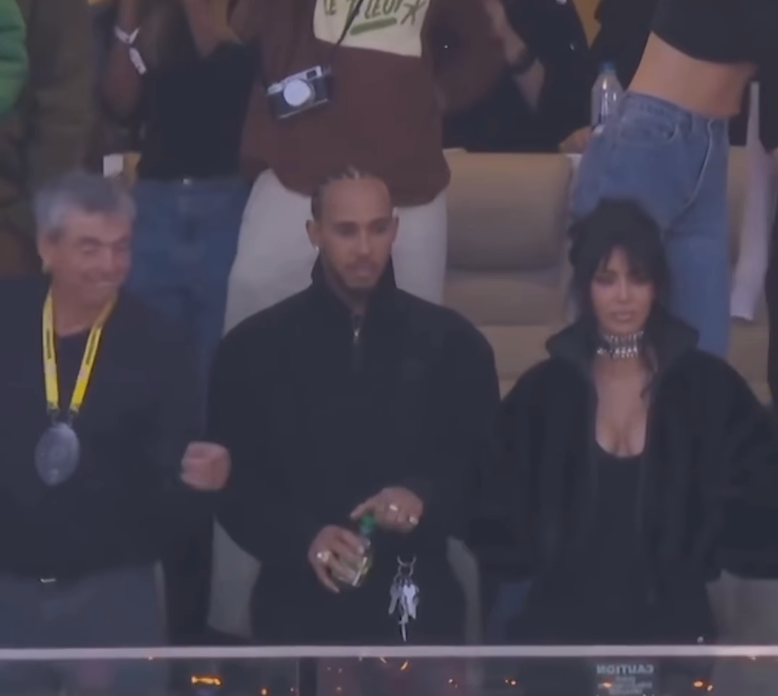 Three radical   lasting  unneurotic  astatine  an event, with 1  holding a drink. The idiosyncratic   connected  the close    is wearing a stylish choker and a jacket