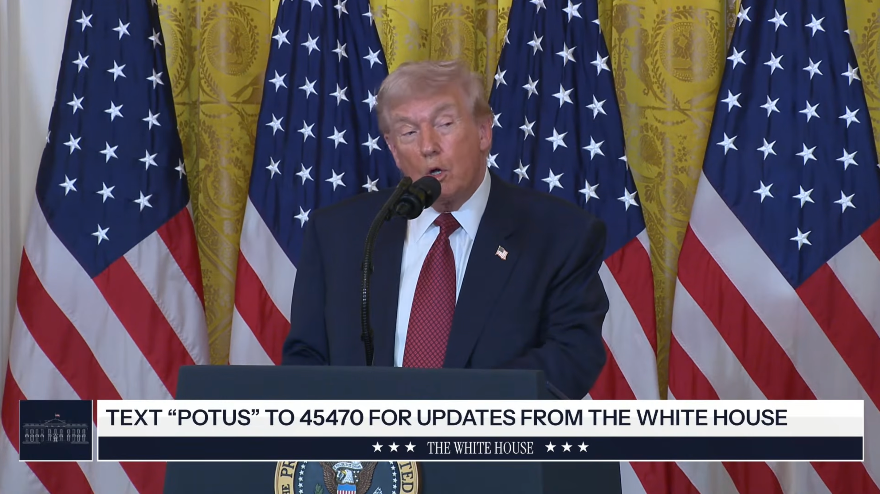 A idiosyncratic   speaks astatine  a podium surrounded by American flags, with a substance   banner encouraging viewers to substance   "POTUS" for White House updates