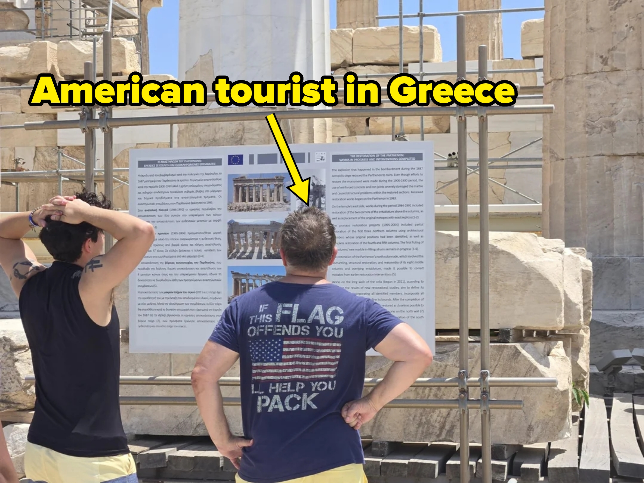 Two radical   work   an informational show  astir  past  ruins. One wears a humorous garment  saying, "If this emblem  offends you, I'll assistance   you pack."