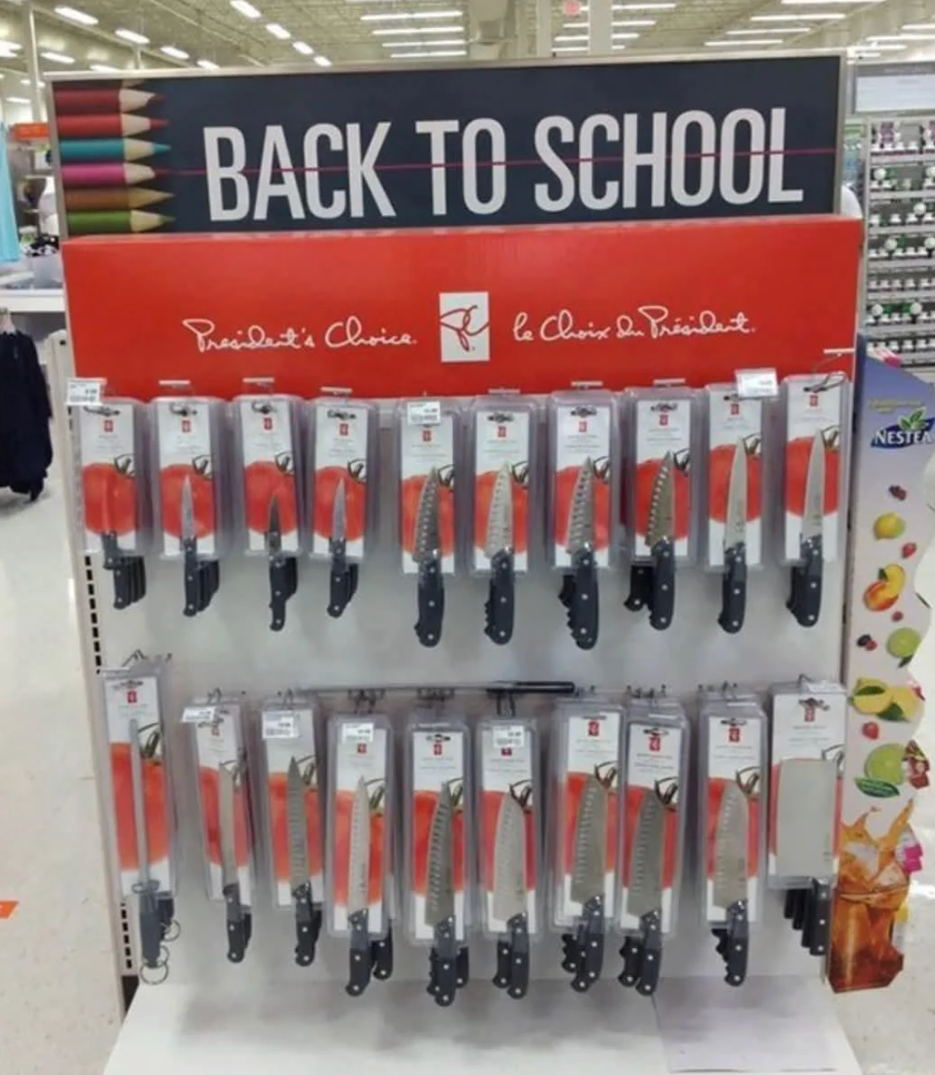 Store show with knives labeled "Back to School" successful a market aisle, highlighting an antithetic promotional setup