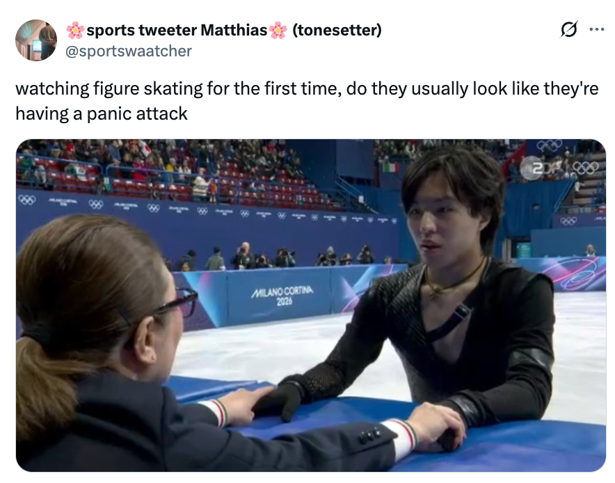 Figure skater, looking tense, successful  speech  with a manager  astatine  an crystal  rink. Audience successful  the background. Tweet jokes astir  fig  skaters' expressions