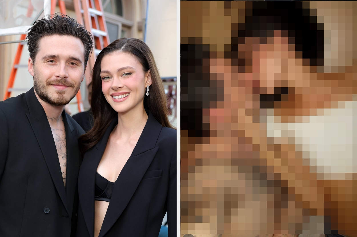 Two individuals, a man in a suit and a woman in a stylish outfit, stand together smiling