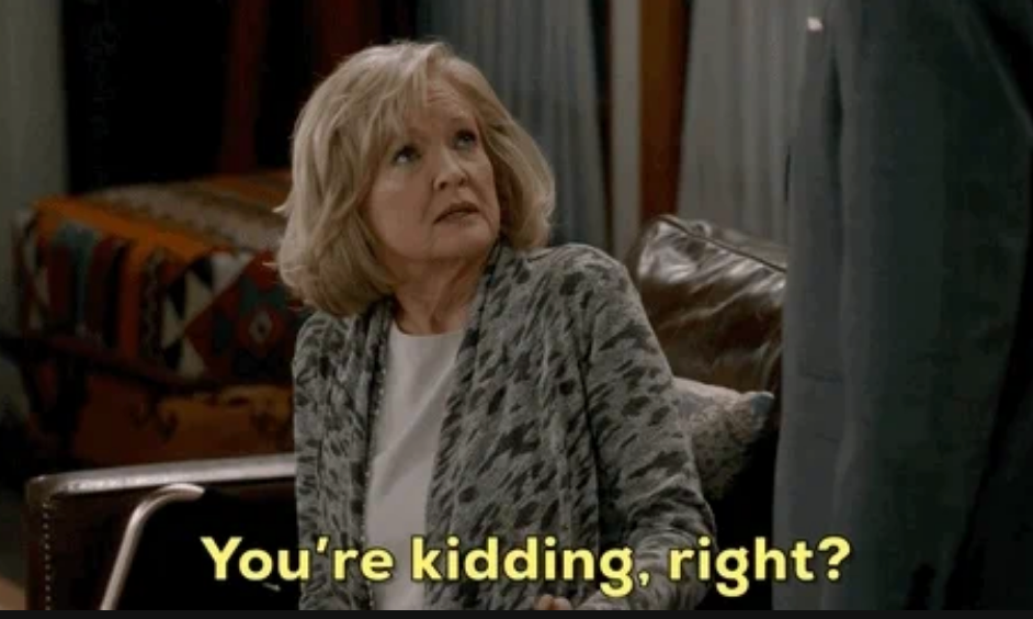 Christine Ebersole, successful  a patterned jacket, sits connected  a couch, looking up   skeptically astatine  idiosyncratic    standing. Text overlay reads, "You're kidding, right?"