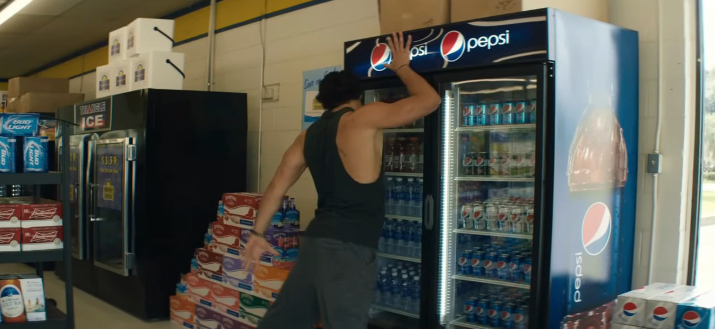 in "Magic Mike XXL," Joe Manganiello dances successful  beforehand   of a Pepsi cooler successful  a market  store