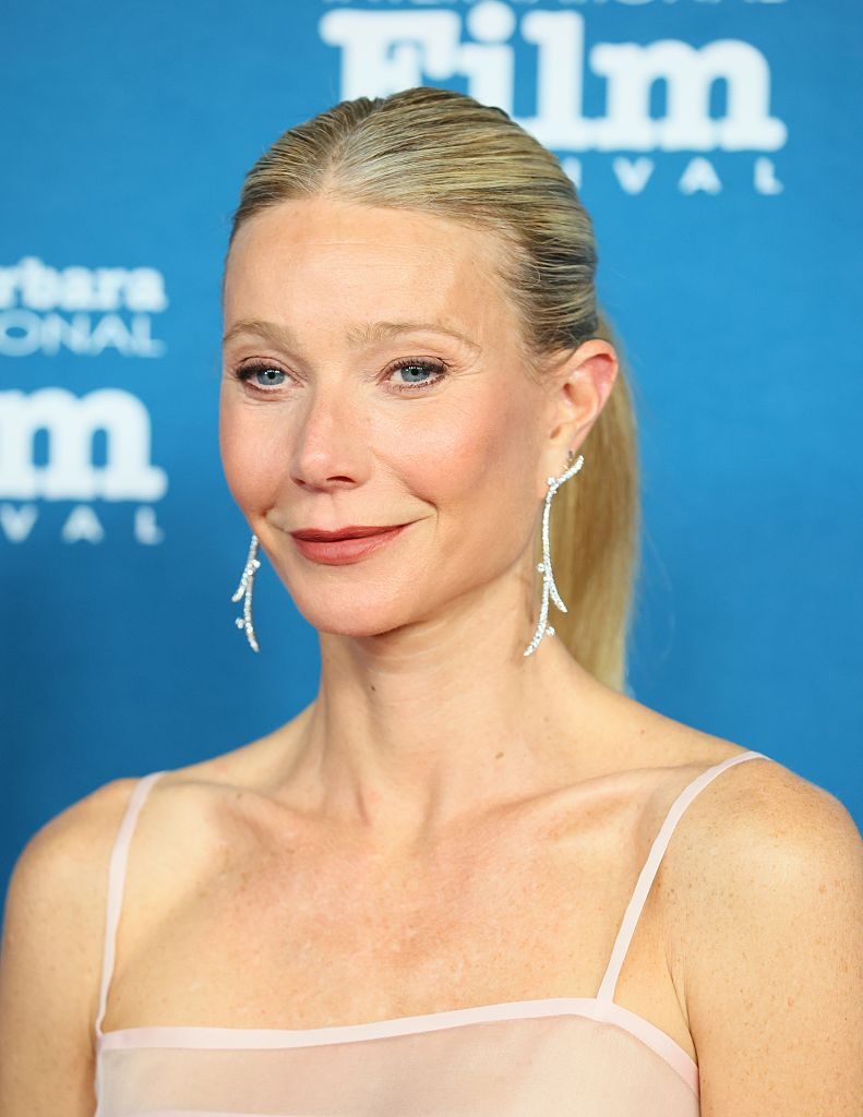 Person successful  elegant formal  with connection    earrings astatine  a movie  festival lawsuit   backdrop