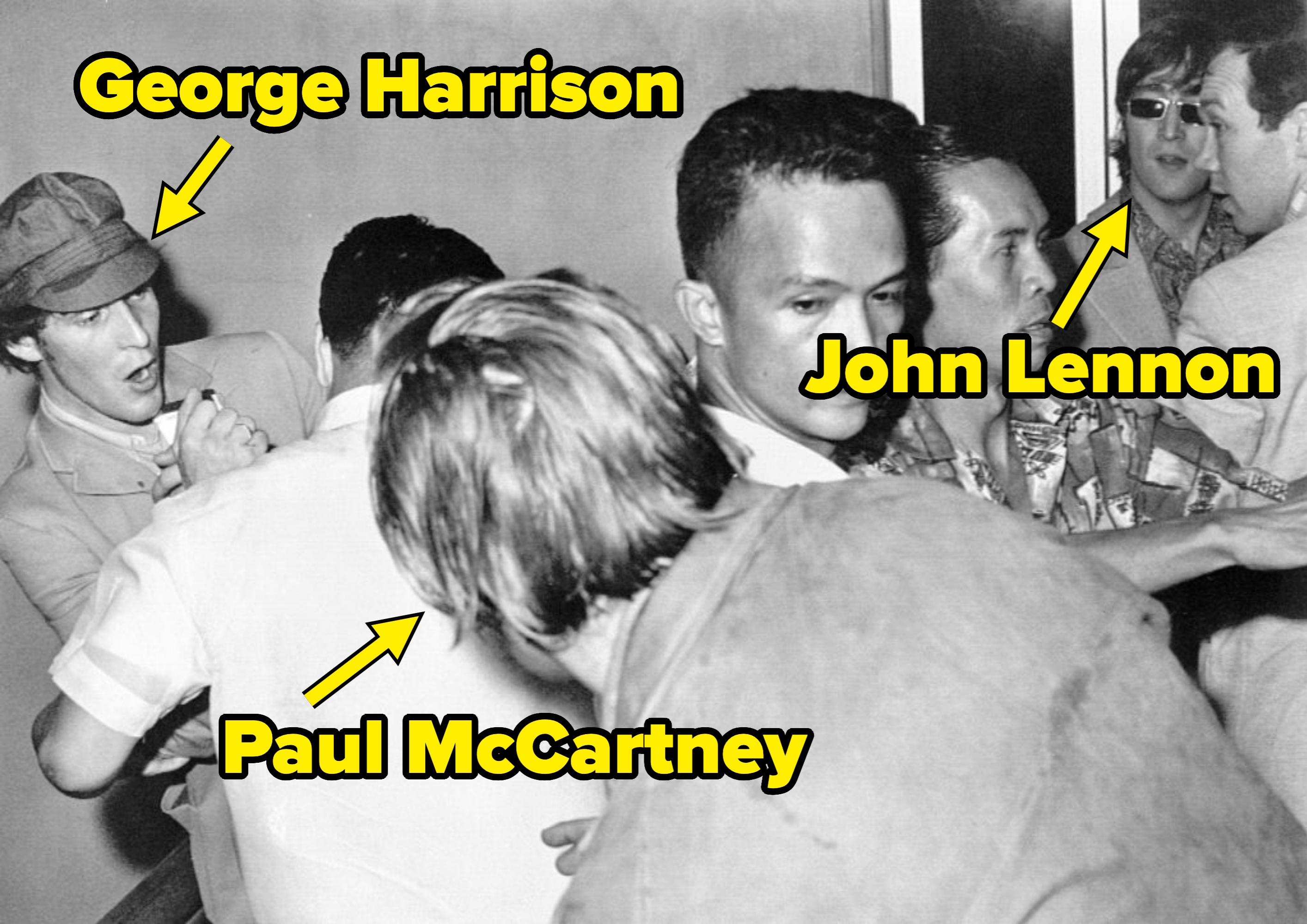 A chaotic country   with respective  people, 1  successful  a cap, struggling successful  a crowd. The ambiance  appears tense and disorderly