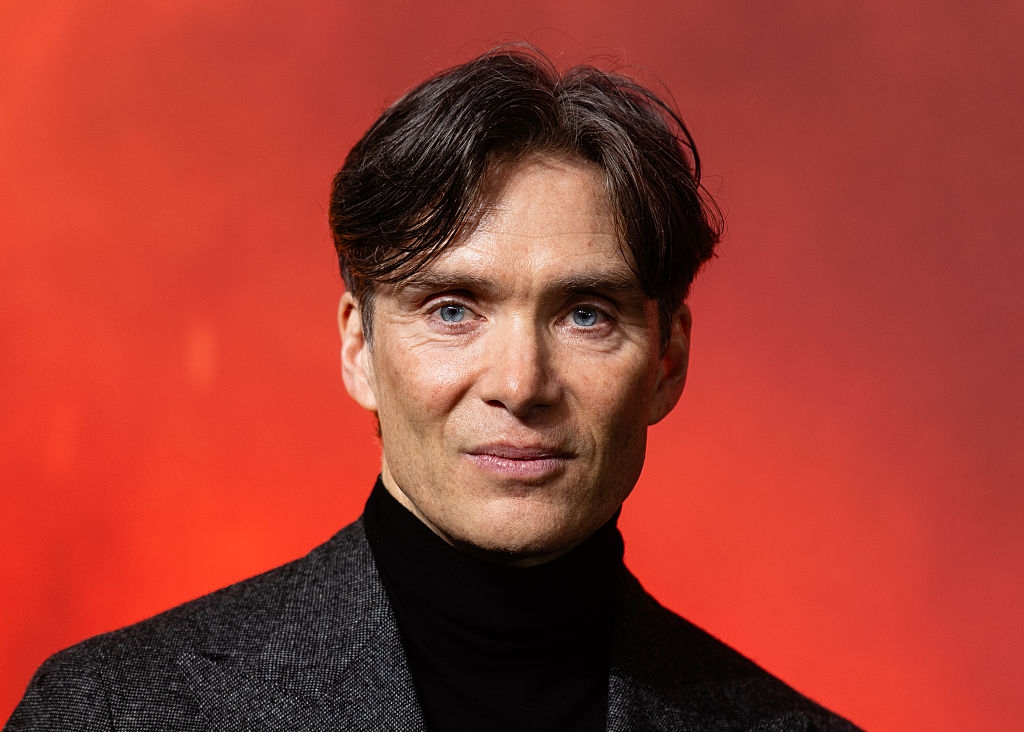 Person successful  a acheronian  turtleneck and blazer is pictured against a coagulated  backdrop, captured successful  a ceremonial  representation    style