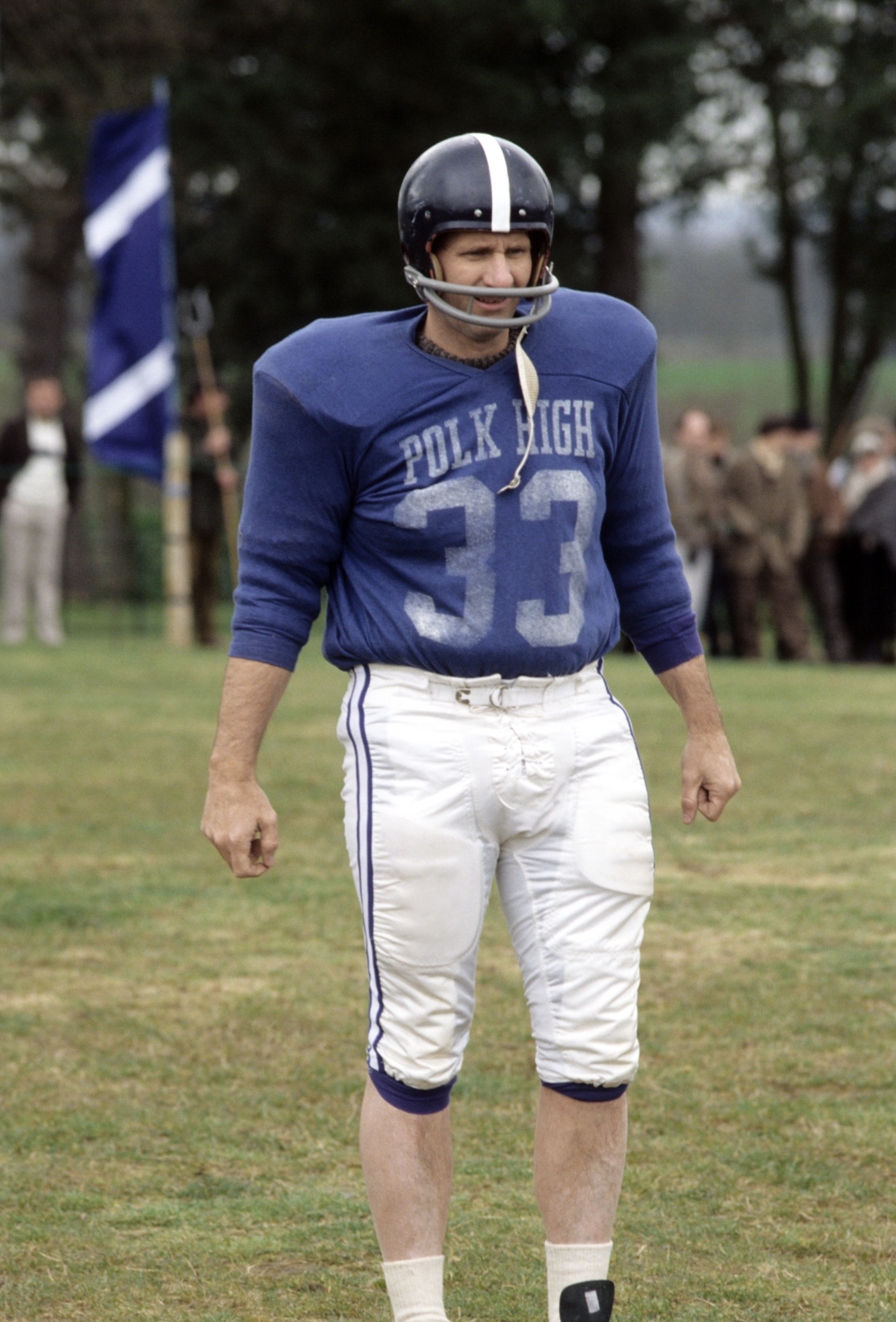 A idiosyncratic   successful  vintage shot   cogwheel  with "Polk High 33" connected  the jersey stands connected  a grassy field