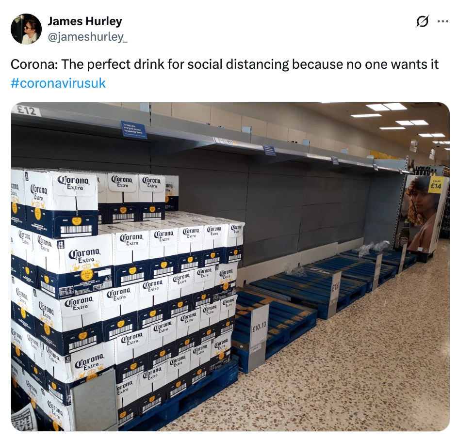 Store shelves mostly empty except for stacked boxes of Corona beer; humorous tweet suggests it’s unwanted during coronavirus concerns