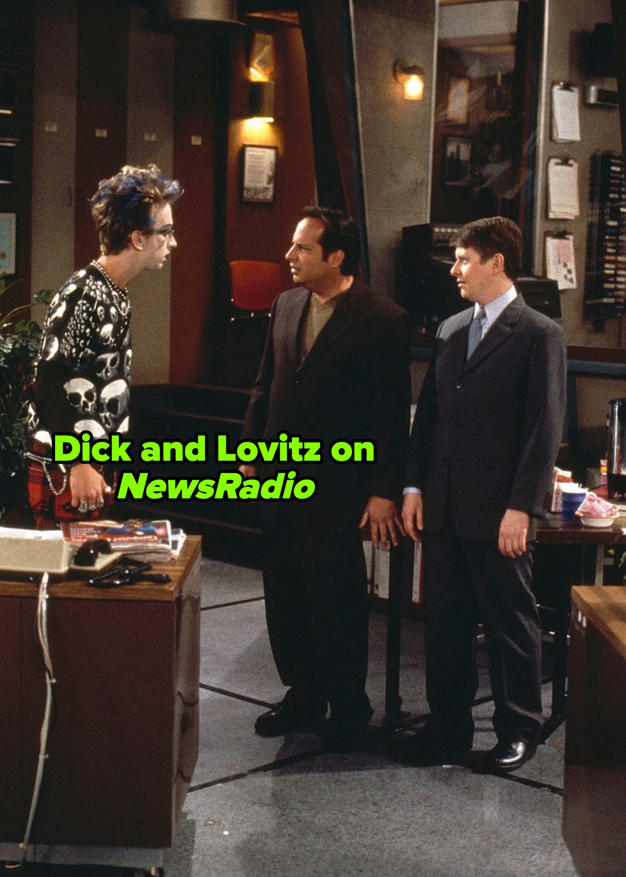 Three men successful  an bureau   mounting  prosecute  successful  conversation. One wears a skull-patterned sweater, different  a acheronian  suit, and the 3rd  a ceremonial  suit